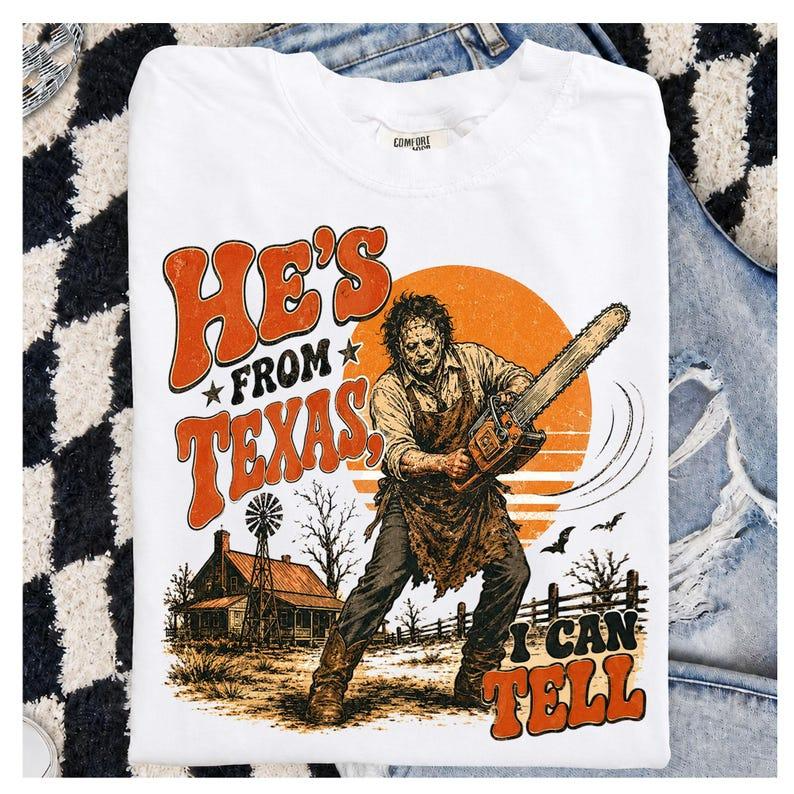 He's From Texas I Can Tell Retro Chainsaw Horror Graphic T-Shirt
