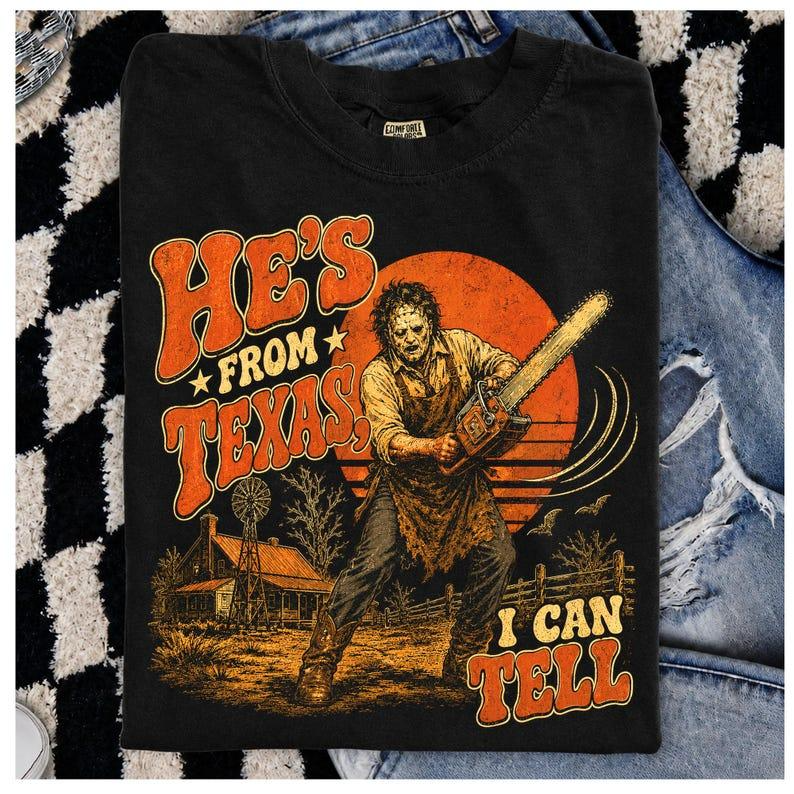 He's From Texas I Can Tell Retro Chainsaw Horror Graphic T-Shirt